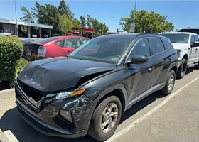 picture of minor front end damage of a black 2023 Hyundai Tucson